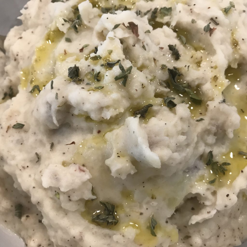 Herbed Garlic Mashed Potatoes topped with olive oil